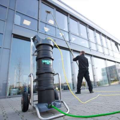 Water-fed pole cleaning commercial glass for a Lathrop business