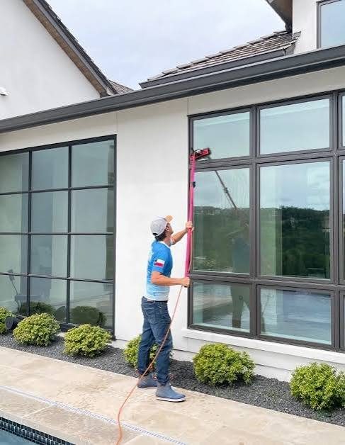 Lathrop window cleaning on a modern home with a water-fed pole